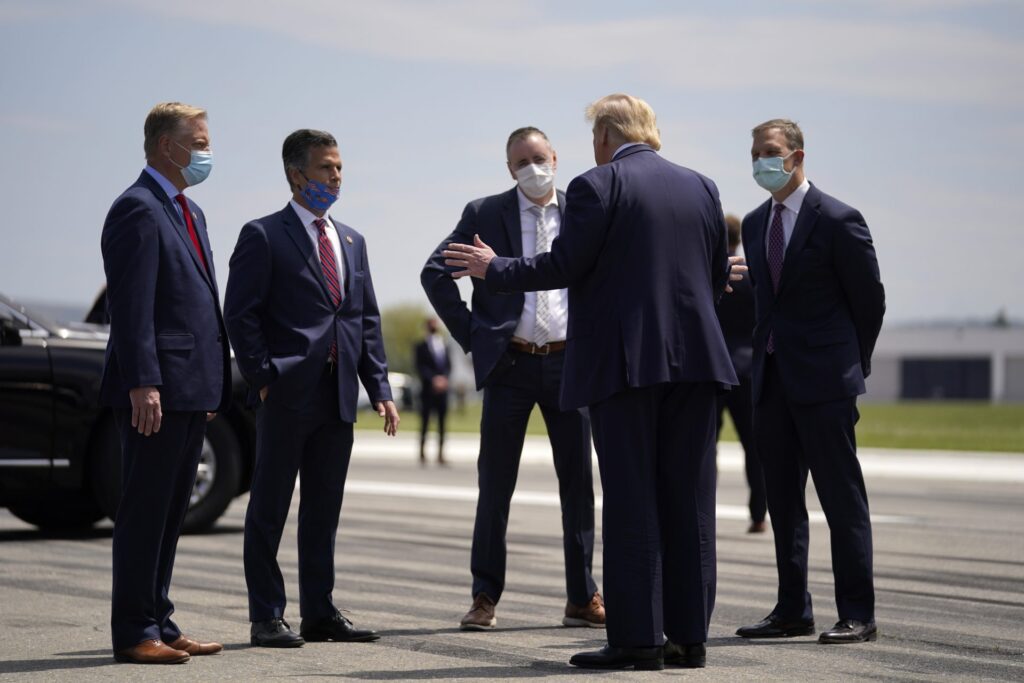 FILE PHOTO: President Donald Trump, second from right, speaks with from left, Rep. Fred Keller, Rep. Dan Meuser, Rep. Brian Fitzpatrick, Rep. Scott Perry after arriving at Lehigh Valley International Airport in Allentown, Pa., Thursday, May 14, 2020. (Evan Vucci / AP Photo)
