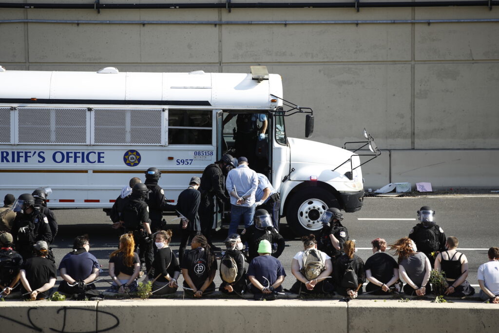 America Protests Philadelphia Police detain protesters in the aftermath of a march calling for justice over the death of George Floyd on Interstate 676 in Philadelphia, Monday, June 1, 2020. Floyd died after being restrained by Minneapolis police officers on May 25. (AP Photo/Matt Rourke)