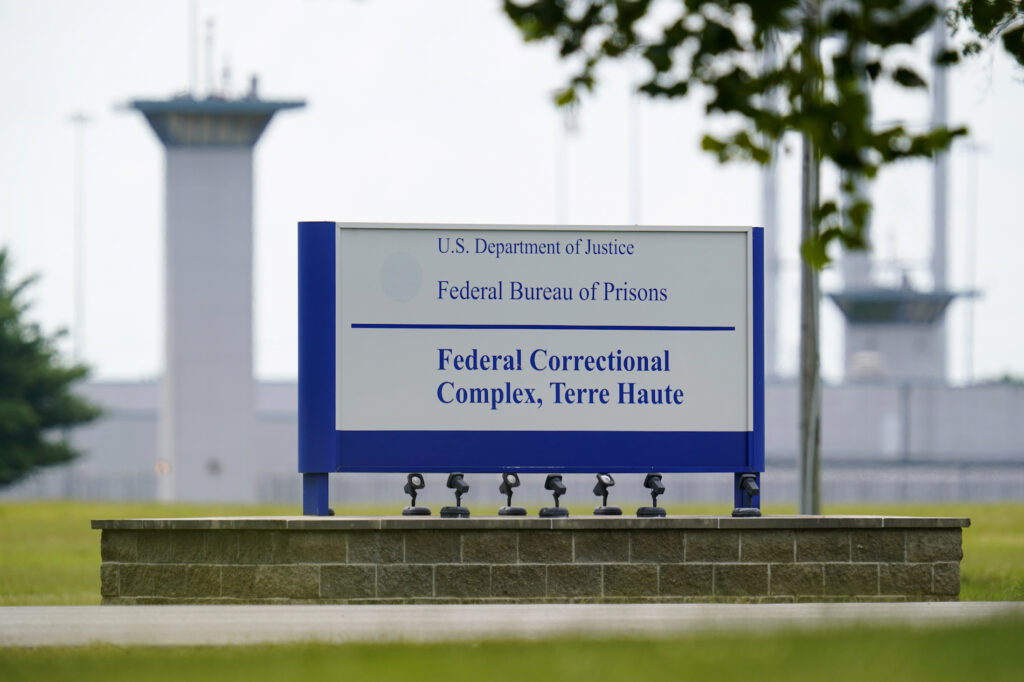 Federal Executions FILE - This Aug. 28, 2020, file photo shows the federal prison complex in Terre Haute, Ind. (AP Photo/Michael Conroy, File)A federal judge said the Justice Department unlawfully rescheduled the execution of the only woman on federal death row, potentially setting up the Trump administration to schedule the execution after president-elect Joe Biden takes office. U.S. District Court Judge Randolph Moss also vacated an order from the director of the Bureau of Prisons that had set Lisa Montgomery’s execution date for Jan. 12, 2021. (AP Photo/Michael Conroy)