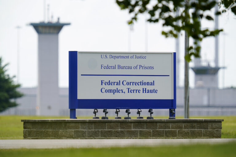FILE - This Aug. 28, 2020, file photo shows the federal prison complex in Terre Haute, Ind.   (AP Photo/Michael Conroy, File)A federal judge said the Justice Department unlawfully rescheduled the execution of the only woman on federal death row, potentially setting up the Trump administration to schedule the execution after president-elect Joe Biden takes office. U.S. District Court Judge Randolph Moss also vacated an order from the director of the Bureau of Prisons that had set Lisa Montgomery’s execution date for Jan. 12, 2021.  (AP Photo/Michael Conroy)