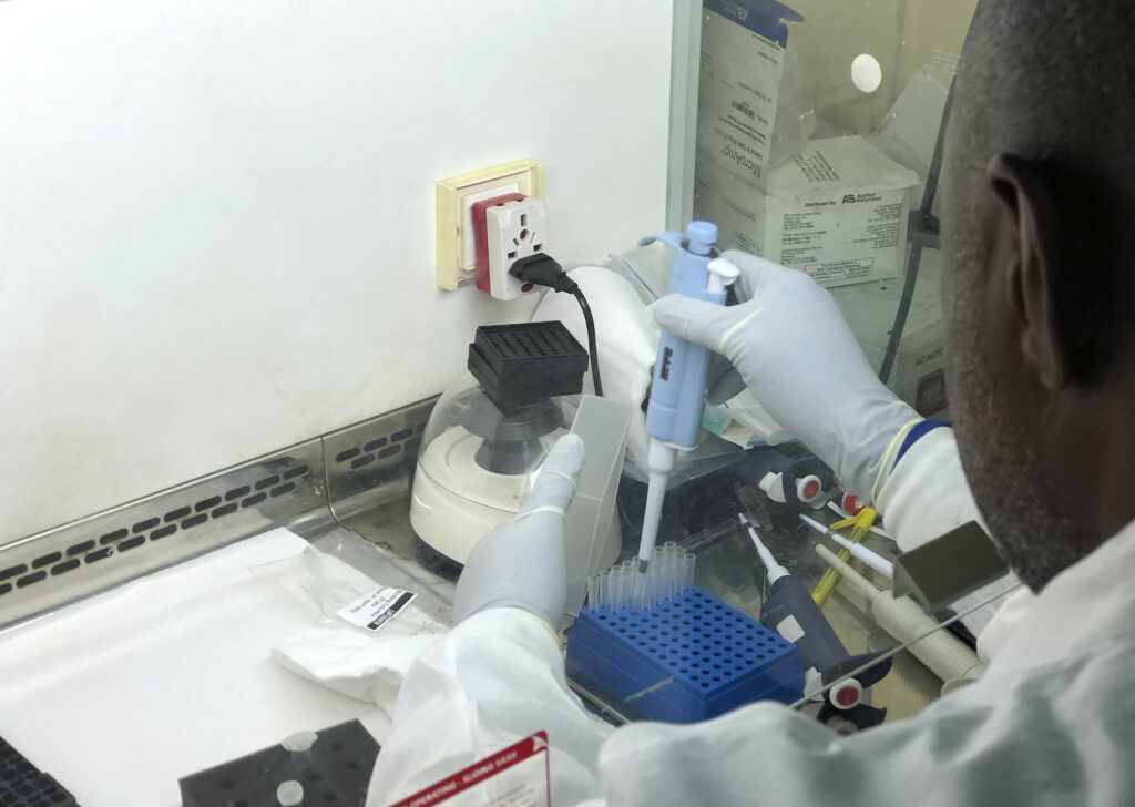 Virus Outbreak Nigeria Variant In this photo taken on Friday Dec. 25, 2020, Virologist Sunday Omilabu in a lab, during an interview with The Associated Press in Lagos, Nigeria. A Nigerian scientist spent the holiday season in his laboratory doing genetic sequencing to learn more about the country’s COVID-19 variant. (AP Photo/Lekan Oyekanmi)