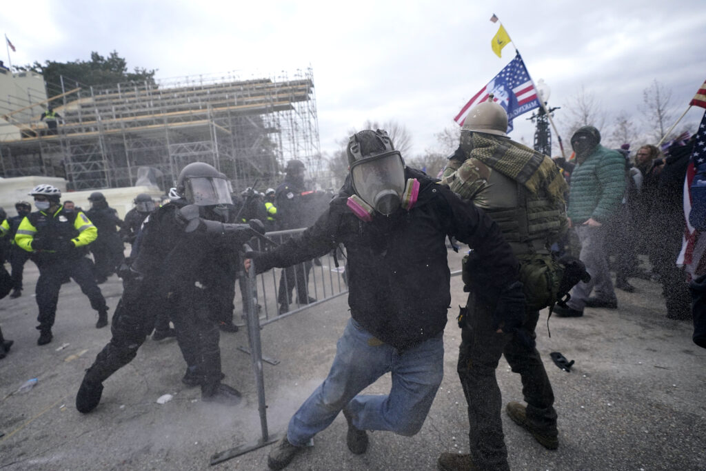 Electoral College Protests Trump supporters try to break through a police barrier, Wednesday, Jan. 6, 2021, at the Capitol in Washington. As Congress prepares to affirm President-elect Joe Biden's victory, thousands of people have gathered to show their support for President Donald Trump and his claims of election fraud. (AP Photo/Julio Cortez)