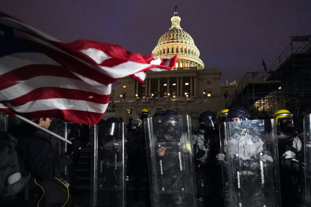 Electoral College Protests Police stand outside the Capitol after a day of rioting protesters, Wednesday, Jan. 6, 2021, at the Capitol in Washington. (AP Photo/Julio Cortez)
