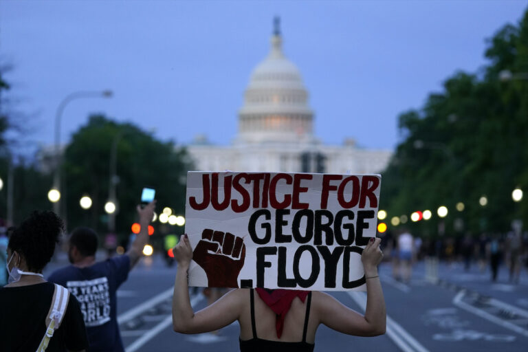In this May 29, 2020, file photo, demonstrators walk along Pennsylvania Avenue as they protest the death of George Floyd in Washington. (AP Photo/Evan Vucci)