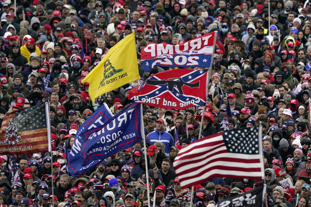 Capitol Breach Civil War People listen as President Donald Trump speaks during a rally Wednesday, Jan. 6, 2021, in Washington. (AP Photo/Evan Vucci)