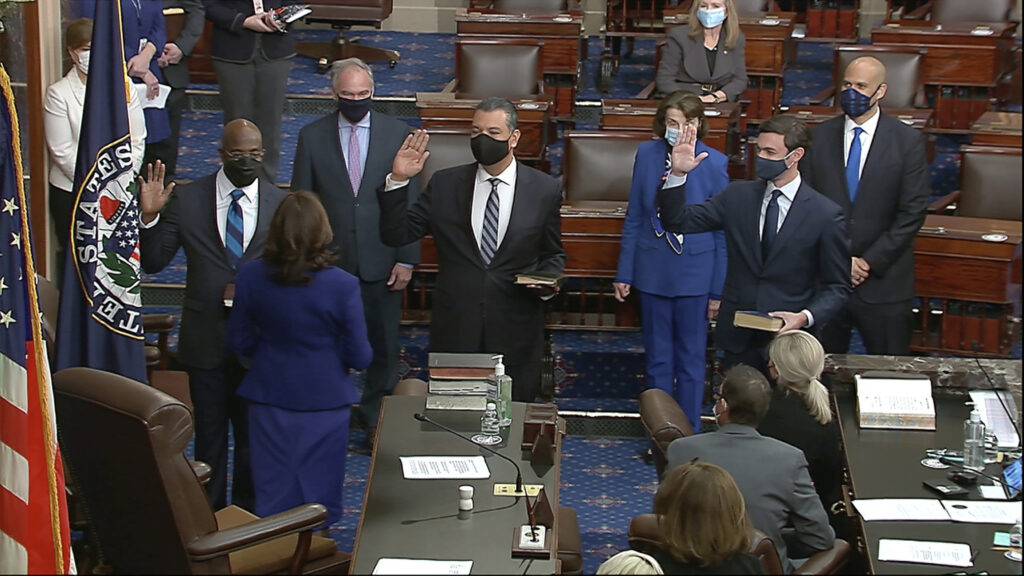 Harris Senate In this image from video, Vice President Kamala Harris swears in Sen. Raphael Warnock, D-Ga., Sen. Alex Padilla, D-Calif., and Sen. Jon Ossoff, D-Ga., on the floor of the Senate Wednesday, Jan. 6, 2021, on Capitol Hill in Washington. (Senate Television via AP)