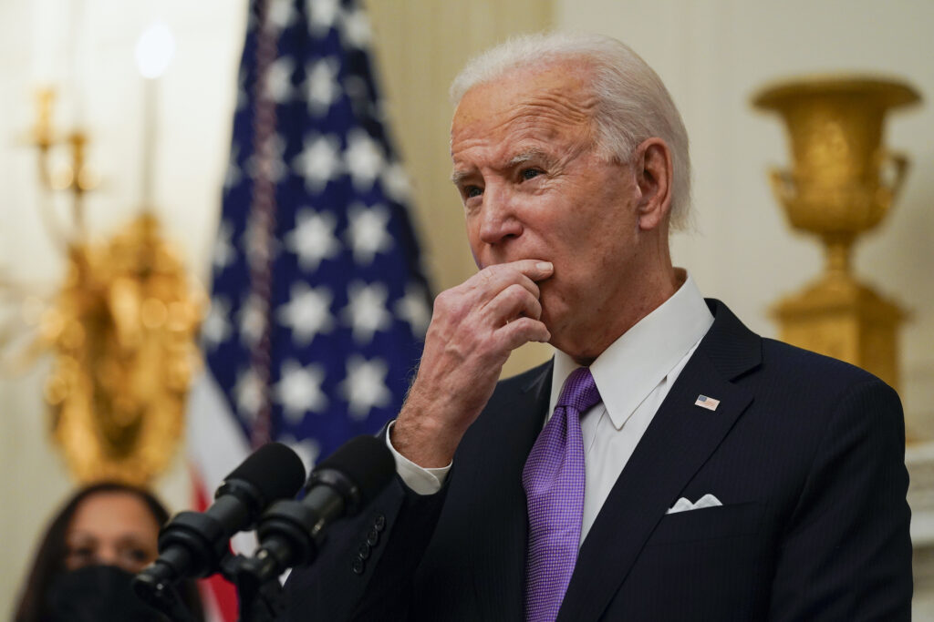 Joe Biden, Kamala Harris President Joe Biden pauses as he speaks about the coronavirus, accompanied by Vice President Kamala Harris, in the State Dinning Room of the White House, Thursday, Jan. 21, 2021, in Washington. (AP Photo/Alex Brandon)