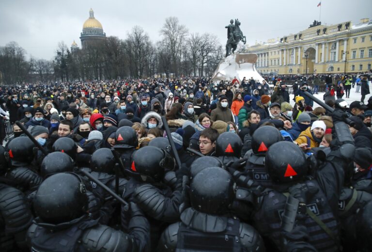 People clash with police during a protest against the jailing of opposition leader Alexei Navalny in St.Petersburg, Russia, Saturday, Jan. 23, 2021. (AP Photo/Dmitri Lovetsky)