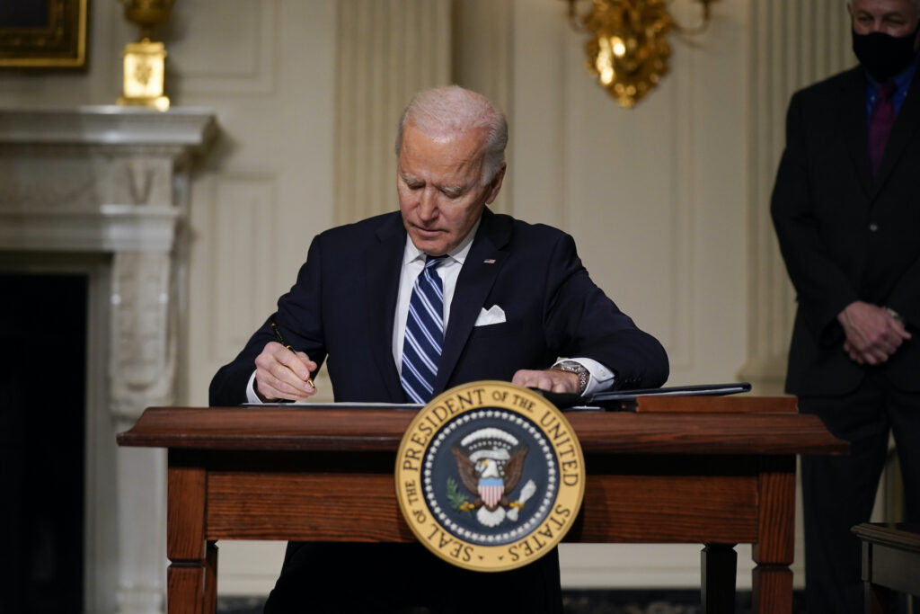 Joe Biden President Joe Biden signs an executive order in the State Dining Room of the White House. (AP Photo/Evan Vucci)