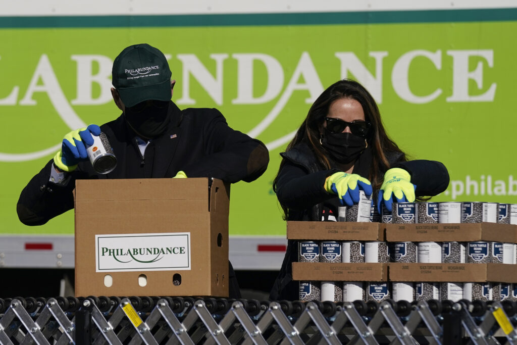 Joe Biden Jill Biden President-elect Joe Biden, left, participates in a National Day of Service event at Philabundance