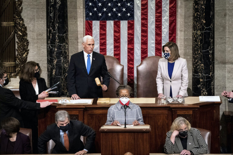 Speaker of the House Nancy Pelosi, D-Calif., and Vice President Mike Pence officiate as a joint session of the House and Senate reconvenes to confirm the Electoral College votes