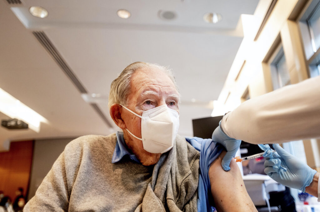 Virus Outbreak California Vaccine Ken Towns receives a first dose of Pfizer-BioNTech COVID-19 vaccine from UC Davis Health