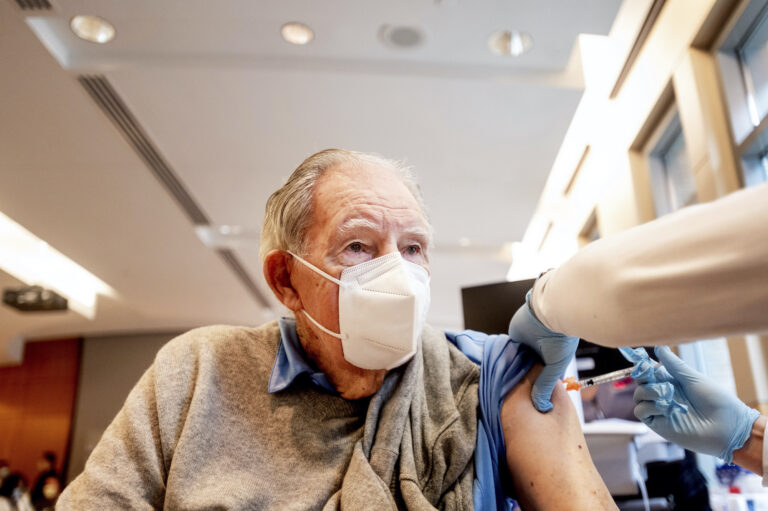 Ken Towns receives a first dose of Pfizer-BioNTech COVID-19 vaccine from UC Davis Health