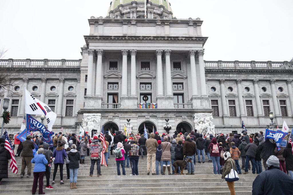 President Donald Trump supporters gather on the statehouse steps as the Pennsylvania House of Representatives are sworn-in