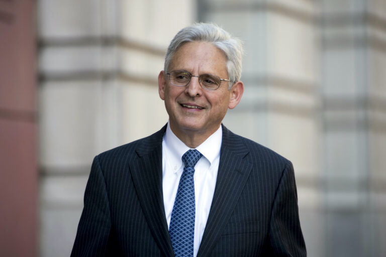Merrick Garland walks into Federal District Court