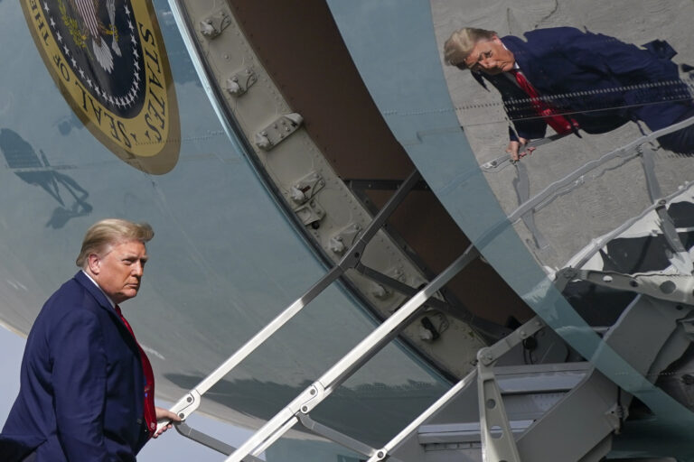 President Donald Trump boards Air Force One at Palm Beach International Airport