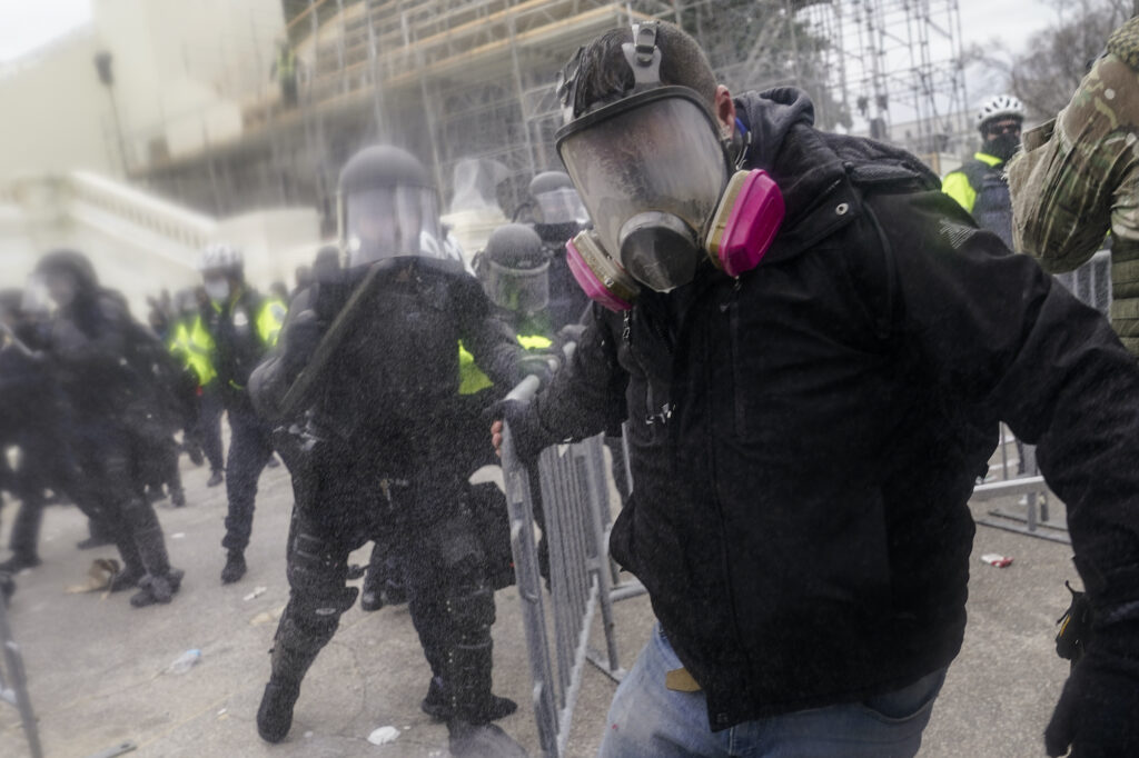 Electoral College Protests Pro-Trump rioters try to break through a police barrier