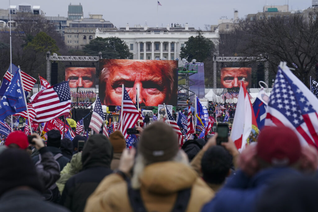 Trump supporters participate in a rally ahead of a violent insurrection at the Capitol building