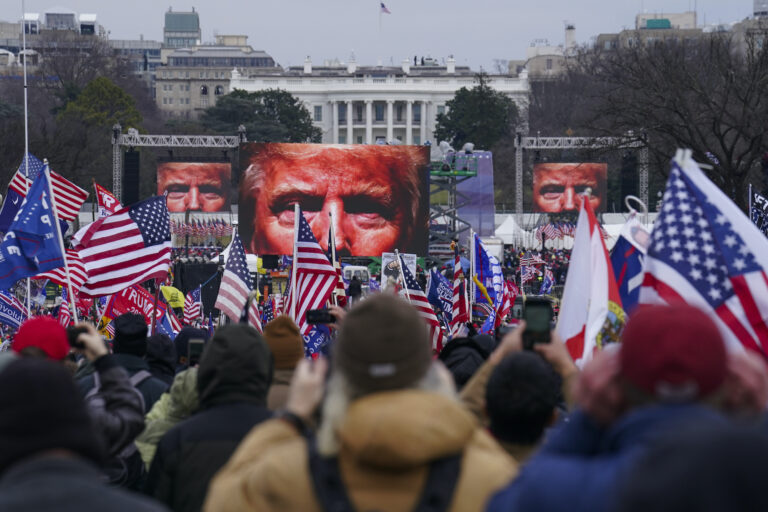 Trump supporters participate in a rally ahead of a violent insurrection at the Capitol building