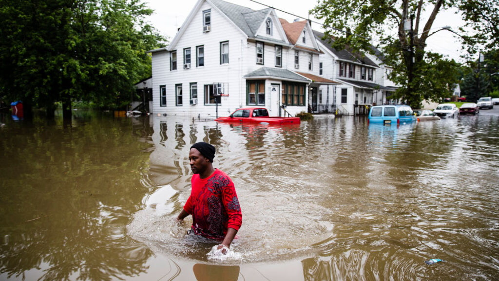 Flood-flooding-Westville-2019 In this June 20, 2019 file photo, Chris Smith makes his way through floodwaters in Westville after severe storms swept across southern New Jersey. (AP Photo/Matt Rourke)