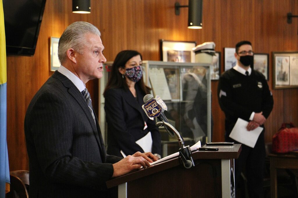 Philadelphia police answer questions about the arrest of Josephus Davis for the murder of a man walking his dog in Brewerytown. From left are Capt. Jason Smith, Assistant District Attorney Joanna Pescatore, and police spokesperson Eric Tripp. (Emma Lee/WHYY)