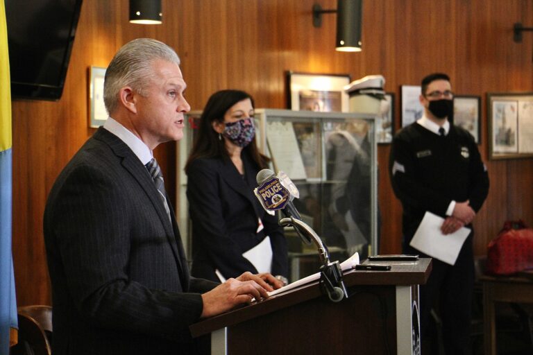 Philadelphia police answer questions about the arrest of Josephus Davis for the murder of a man walking his dog in Brewerytown. From left are Capt. Jason Smith, Assistant District Attorney Joanna Pescatore, and police spokesperson Eric Tripp. (Emma Lee/WHYY)