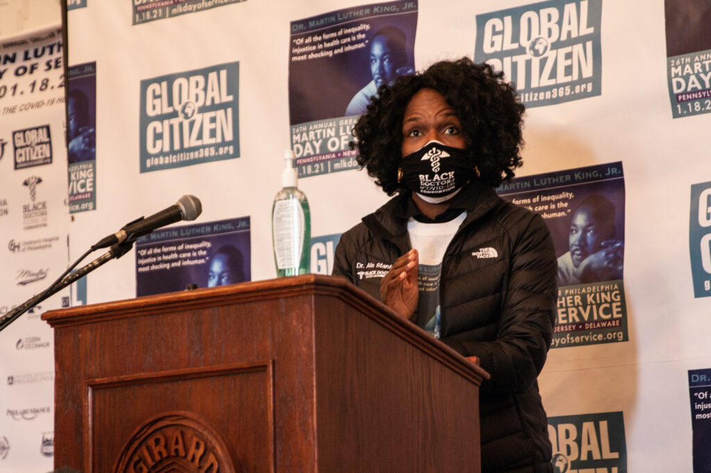 Dr. Ala Stanford speaks at a podium during an MLK Day of Service event