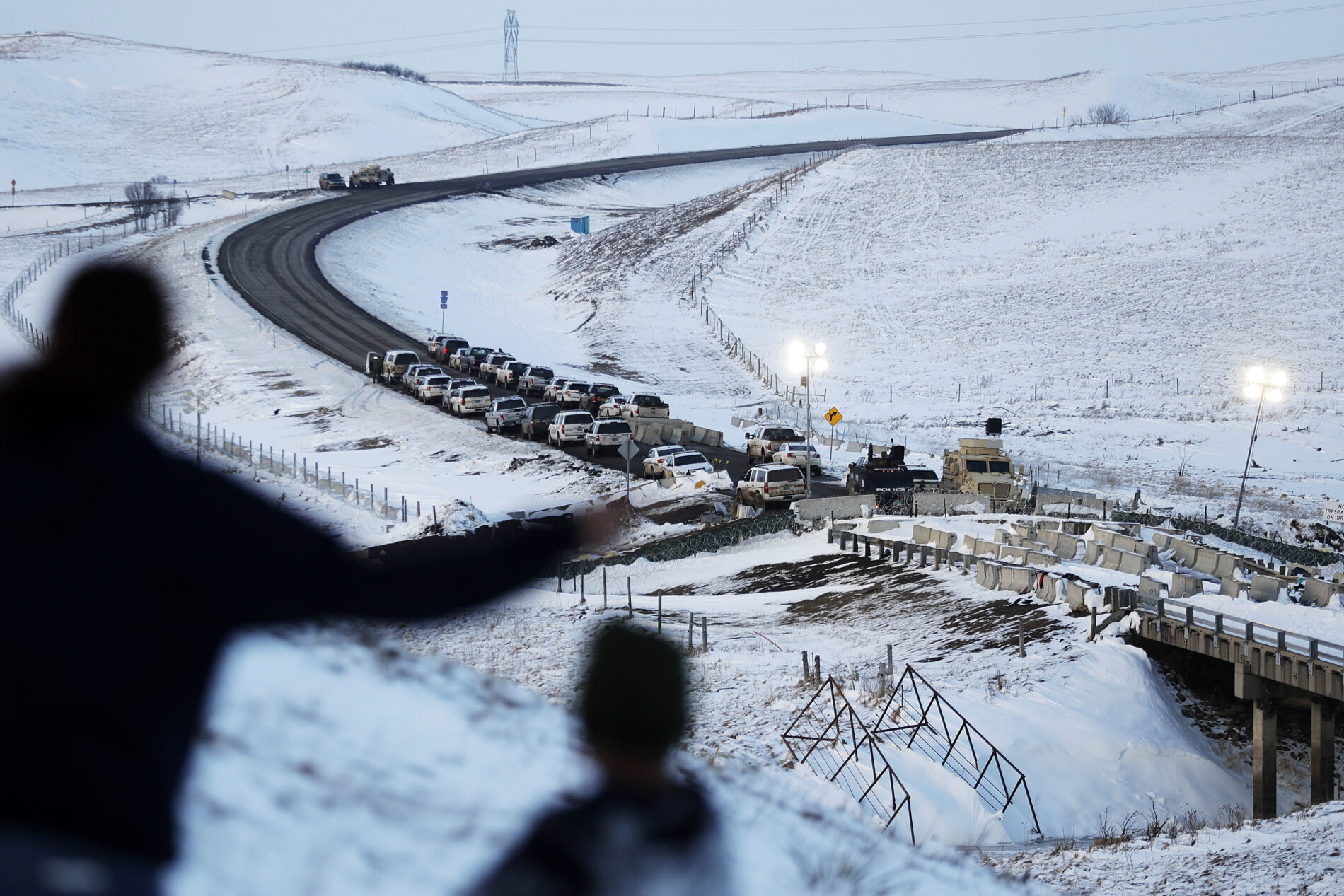 Vehicles line a road near a blocked bridge next to the Oceti Sakowin camp where protesters gathered in Cannon Ball, N.D. Much of the Dakota Access pipeline project controversy has been a small portion running under the Missouri River. Members of the Standing Rock Sioux tribe, whose reservation lies just downstream, have worried that a leak could contaminate their drinking water and sacred lands.