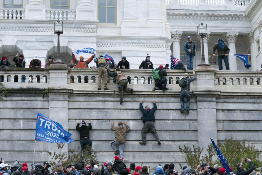 APTOPIX Electoral College Protests Pro-Trump insurrectionists climb the west wall of the the U.S. Capitol