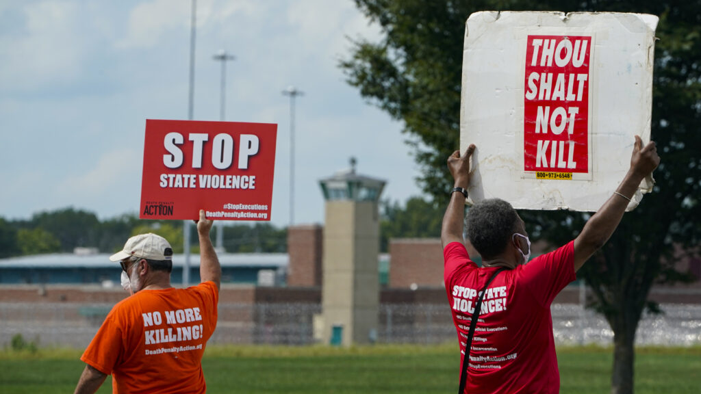 Protesters gather near the the federal prison complex in Terre Haute, Ind., on Aug. 28, 2020, ahead of the scheduled execution of Keith Dwayne Nelson, who was convicted of kidnapping, raping and murdering at 10-year-old Kansas girl. Democrats are pushing new legislation to outlaw federal executions. Protesters gather near the the federal prison complex in Terre Haute, Ind., on Aug. 28, 2020, ahead of the scheduled execution of Keith Dwayne Nelson, who was convicted of kidnapping, raping and murdering at 10-year-old Kansas girl. Democrats are pushing new legislation to outlaw federal executions. (Michael Conroy/AP)