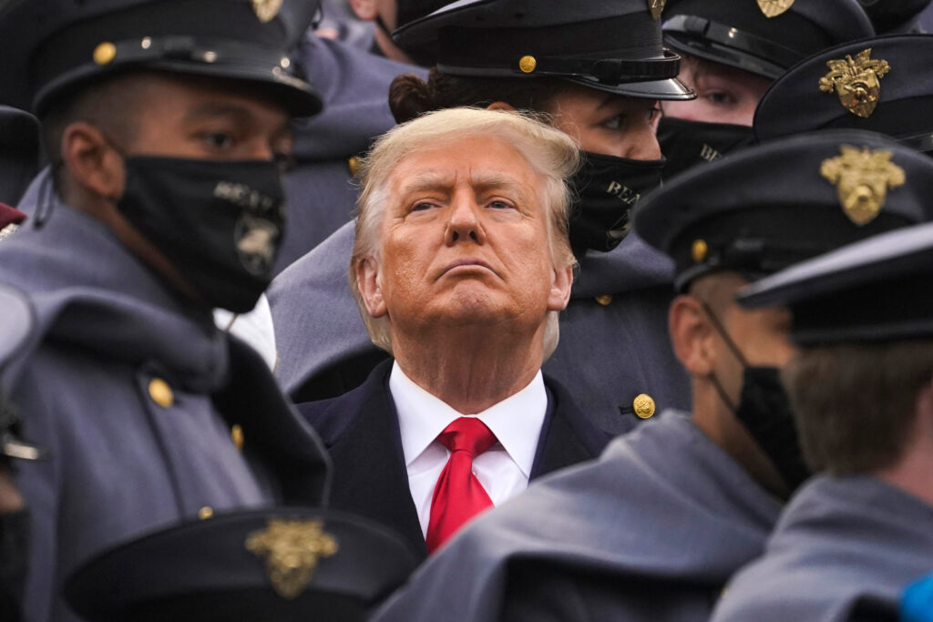 Surrounded by Army cadets, President Trump watches the Army-Navy football game at the U.S. Military Academy in West Point, N.Y., on Dec. 12. Surrounded by Army cadets, President Trump watches the Army-Navy football game