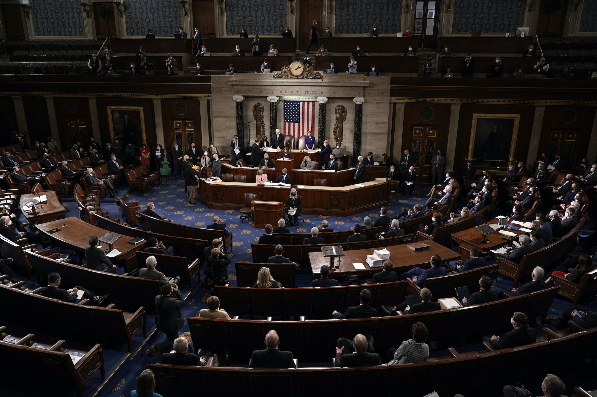 Speaker of the House Nancy Pelosi, D-Calif., and Vice President Mike Pence officiate as a joint session of the House and Senate convenes to confirm the Electoral College votes cast in November's election