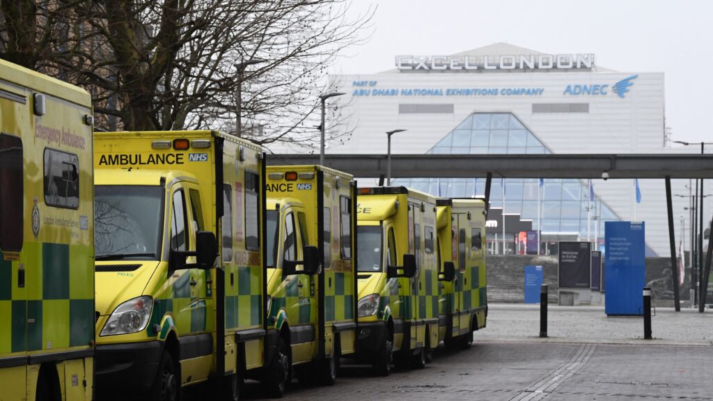 Ambulances are parked outside the NHS Nightingale hospital at the ExCeL center in east London on Friday. Hospitals in the U.K. are preparing for an influx of patients as the coronavirus continues to spread. Ambulances are parked outside the NHS Nightingale hospital at the Excel centre in east London on January 1, 2021