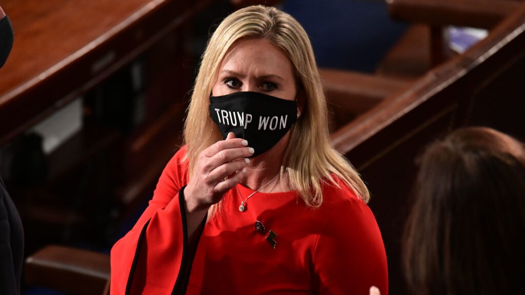 Rep. Marjorie Taylor Greene, R-Ga., wears a “Trump Won” face mask as she arrives on the floor of the House to take her oath of office as a newly elected member of the House of Representatives on Jan. 3. US Rep. Marjorie Taylor Greene (R-GA) wears a