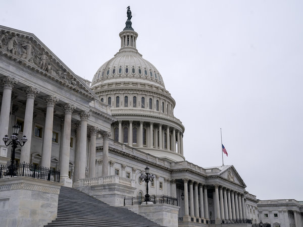 An American Flag flies at half staff at the U.S. Capitol