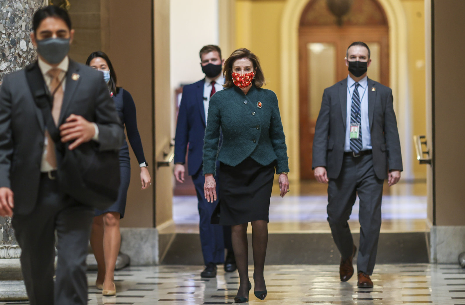 House Speaker Nancy Pelosi, D-Calif., heads back to her office after opening up the House floor on Monday