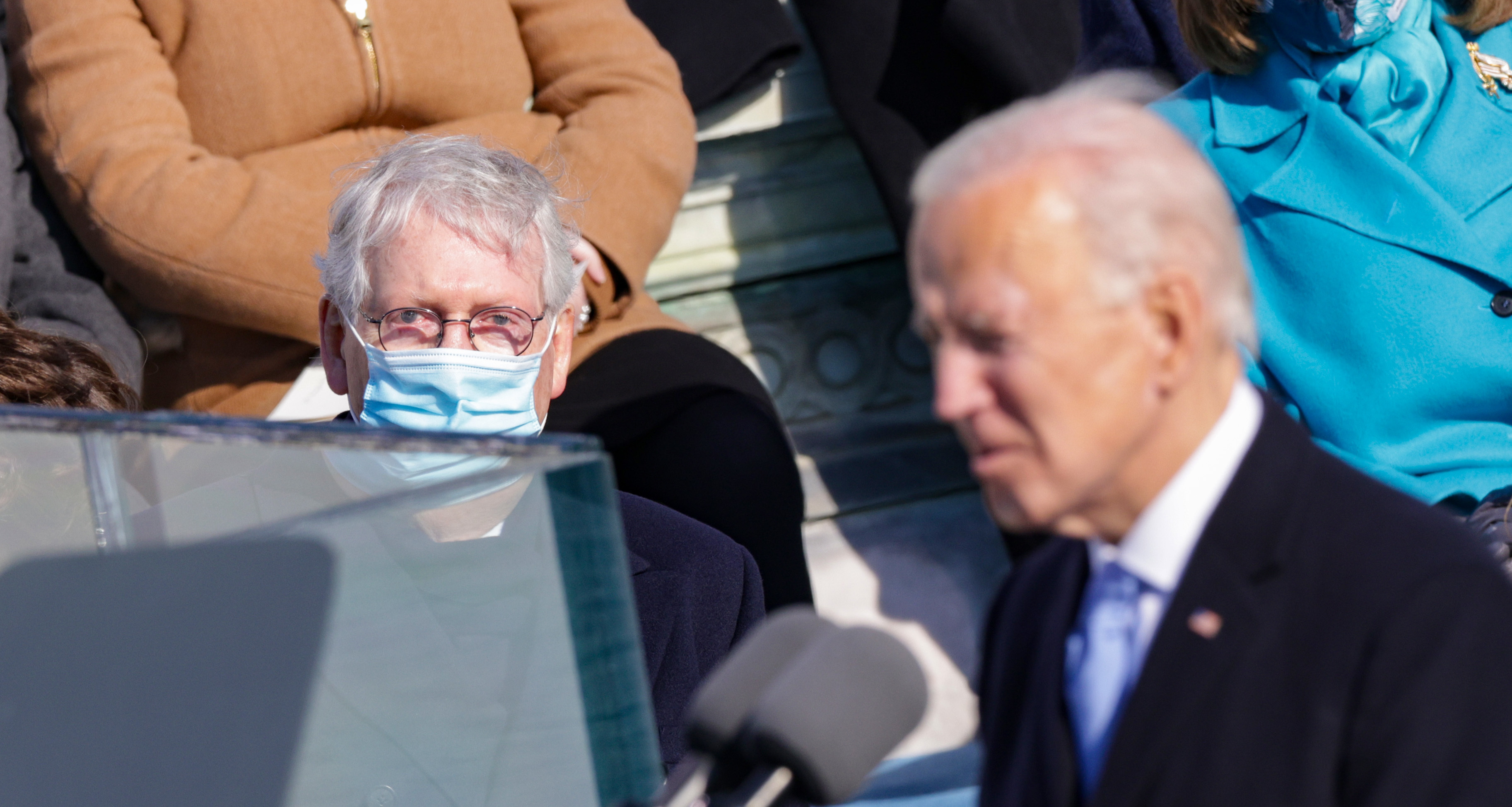 Senate Republican leader Mitch McConnell looks on as President Biden delivers his inaugural address