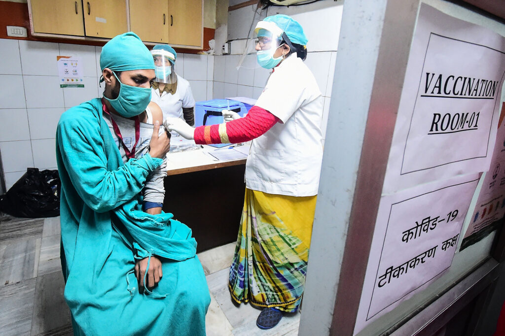 Volunteers and health officials hold a dry run for the coronavirus vaccine at a hospital in Allahabad, India. There’s concern that drug patents will keep lower income countries from getting the doses they need in a timely fashion. Volunteers and health officials hold a dry run for the coronavirus vaccine at a hospital in Allahabad