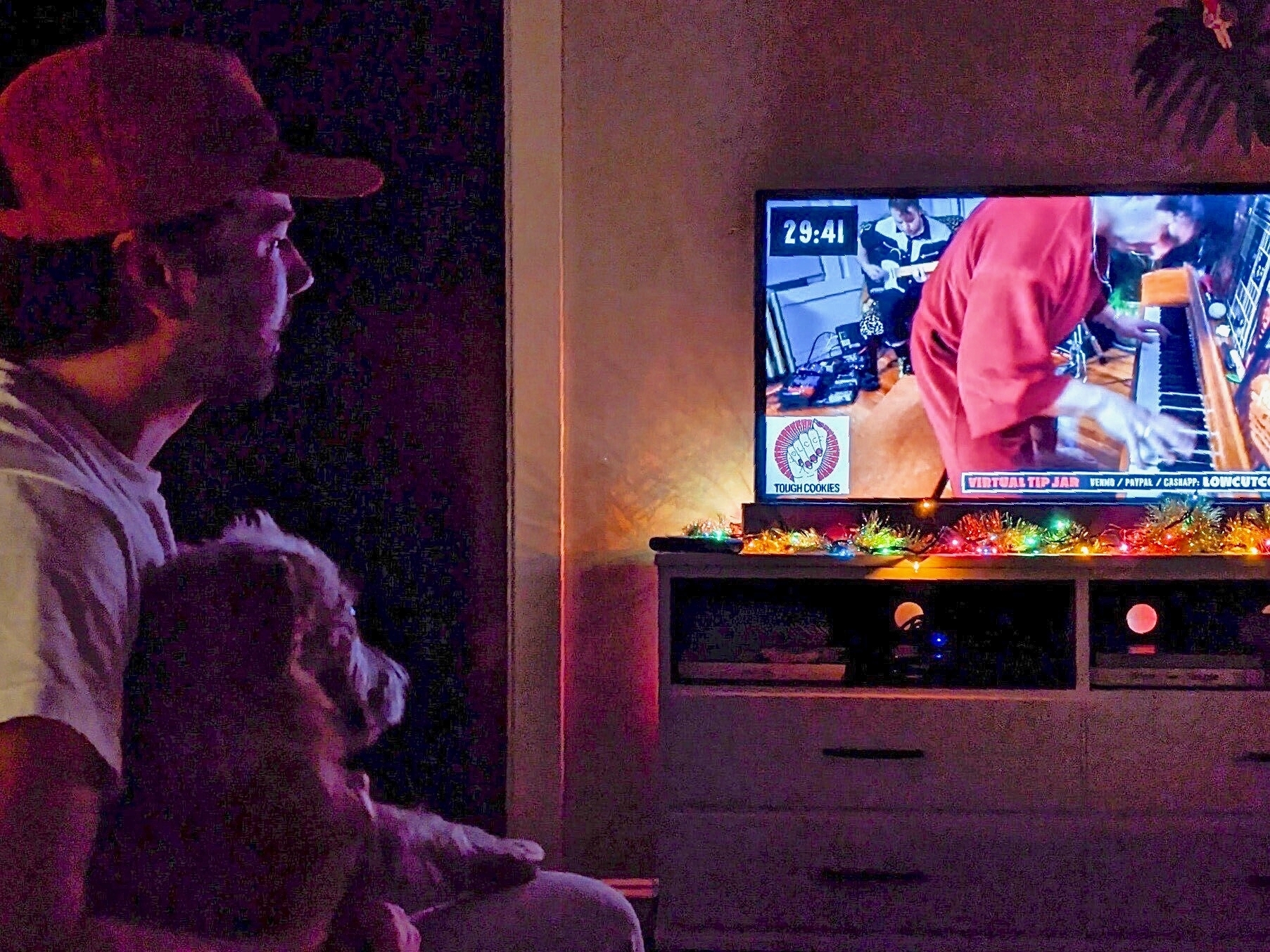 Mike Kaiser and his dog, Rooney, watching a Low Cut Connie livestream concert New Year's Eve.