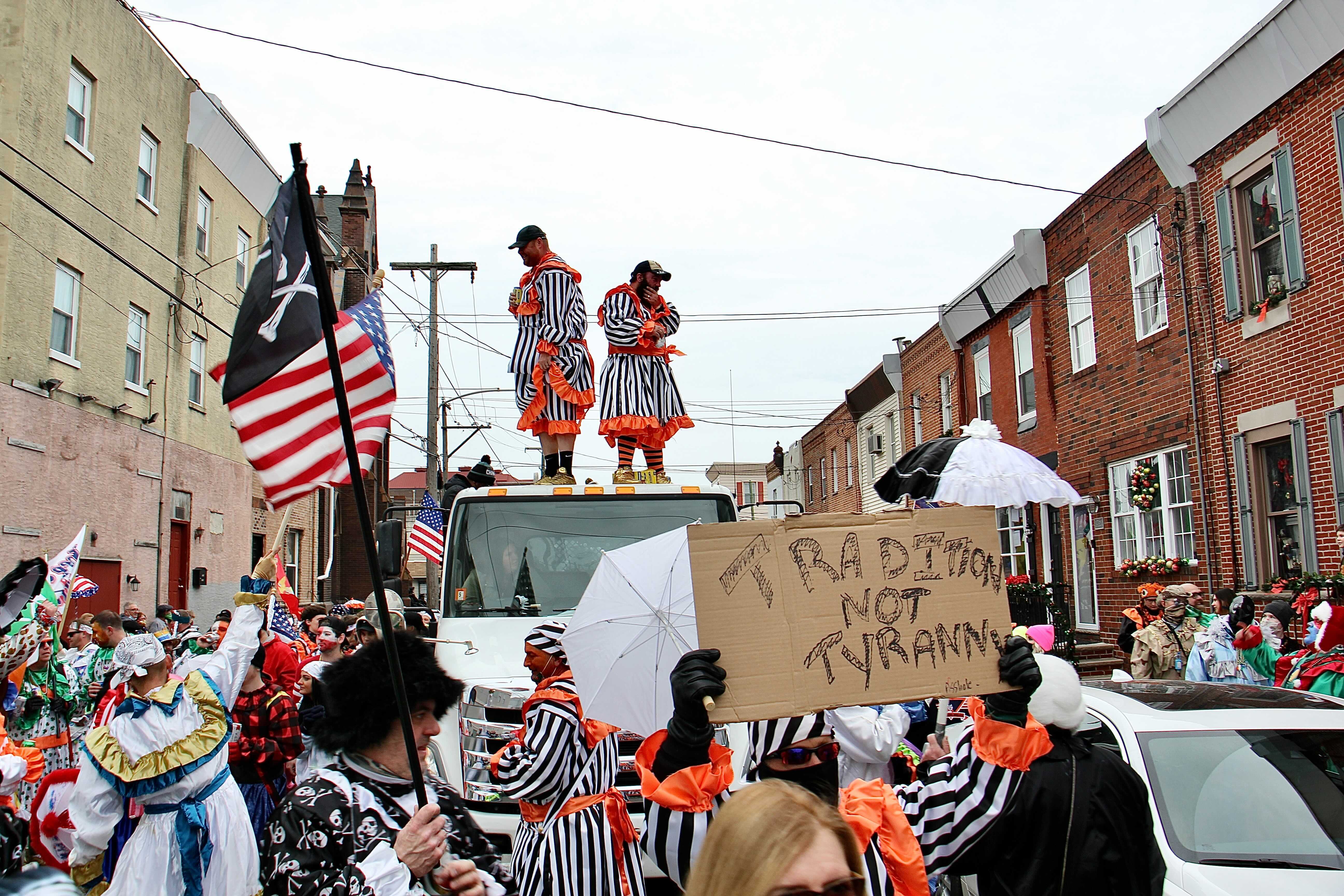 Mummers march on 3rd Street in protest of the cancellation of their annual New Year’s Day parade.