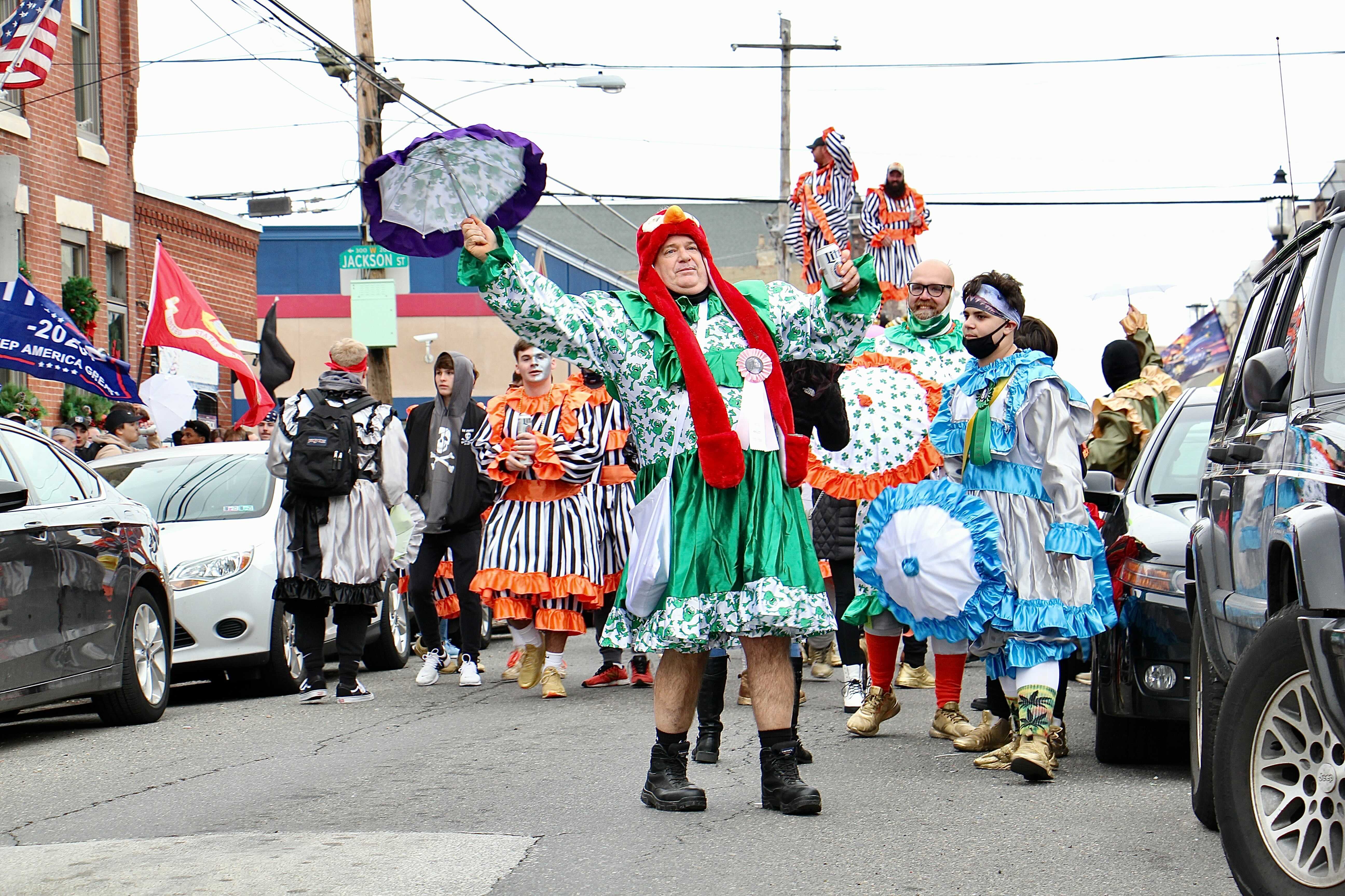 Mummers march on 3rd Street in protest of the cancellation of their annual New Year’s Day parade.