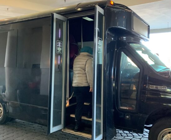 An hourly shuttle transports tenants to and from a bus hub so they can go to work, do errands, or visit family and friends. (Courtesy of Kim Eppehimer)