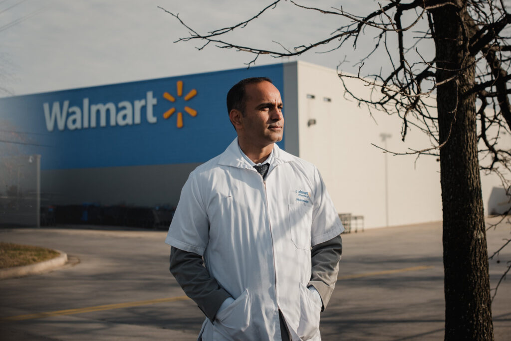 Ashwani Sheoran, 37, stands for a portrait near a Walmart in Elkton