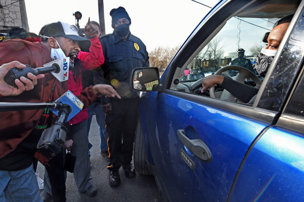 01 (1) At a Feb. 10 protest of school closures outside Wiggins Elementary School in Camden, public school advocate Gary Frazier confronts Camden School Superintendent Katrina McCombs as McCombs tries to leave after touring the school. (April Saul/WHYY)
