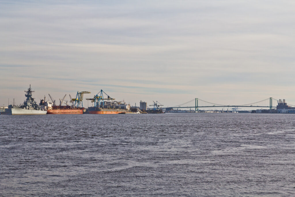 Ships on the Delaware River with the bridge in the background