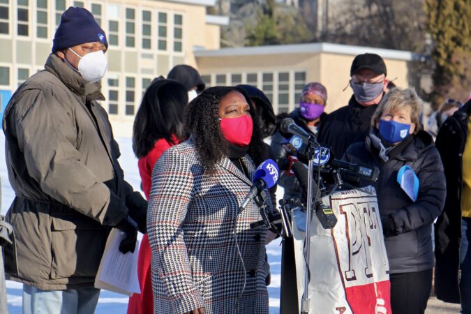 City Councilmember Kendra Brooks stands with teachers protesting the district's reopening plan