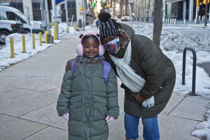 Sharon Stewart walks her 6-year-old granddaughter Sana to Russell Byers Charter School in Center City