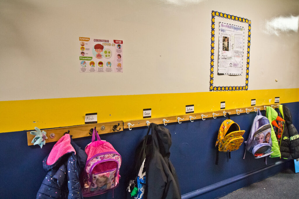 2021 02 15 k paynter st. pio elementary covid era-12 Spaced out coats and book bags at St. Pio Regional Catholic School