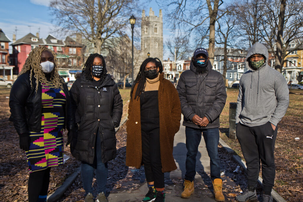 2021 02 17 k paynter public saftey survey (From left) Nikki Grant, with the Amistad Law Project, Kendra Van de Water with YEAH Philly, Clarise McCants with the Movement Alliance Project, and James Aye and Kameron Troy with YEAH Philly, at Malcolm X Park in West Philadelphia. (Kimberly Paynter/WHYY)