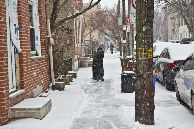 People in Fishtown shovel outside their homes